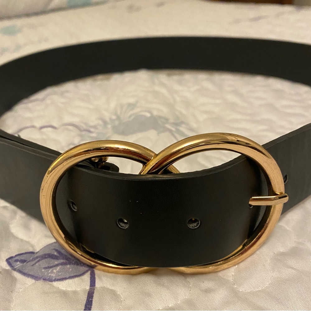 Women’s black faux leather belt. 41 inches in length